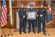 Chief Conley, Lt. Fitzgerald and Officer Machain receiving the MPD's certification award.